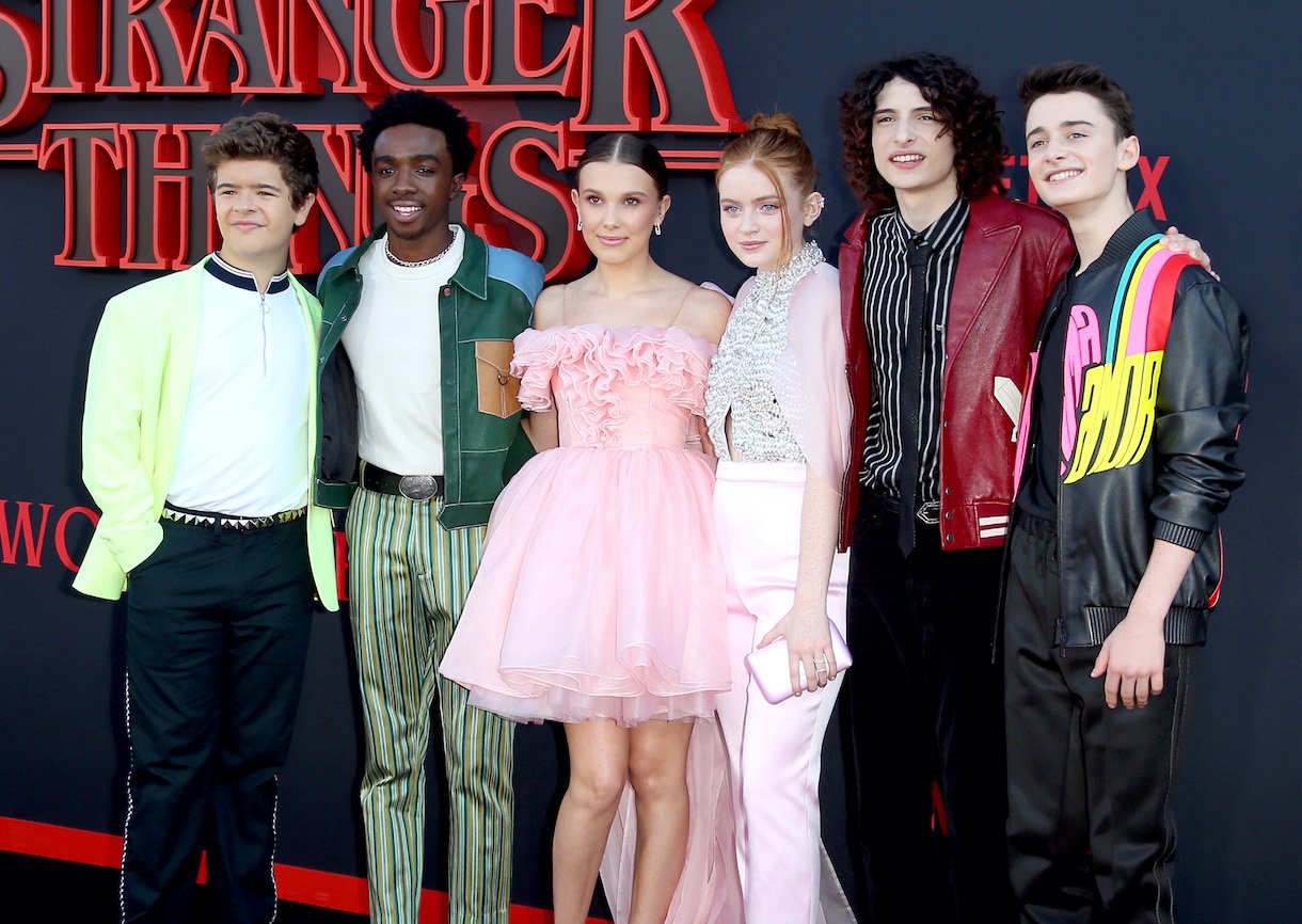 Gaten Matarazzo, Caleb McLaughlin, Millie Bobby Brown, Sadie Sink, Finn Wolfhard, and Noah Schnapp attend the premiere of Netflix's 'Stranger Things'