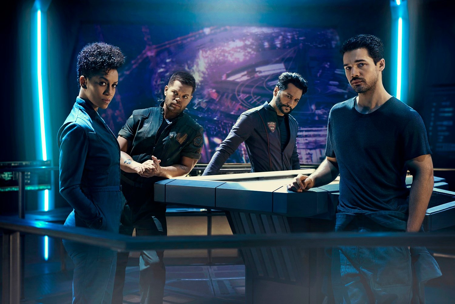 The Expanse cast Dominique Tipper as Naomi Nagata, Wes Chatham as Amos Burton, Cas Anvar as Alex Kamal, and Steven Strait as James Holden 