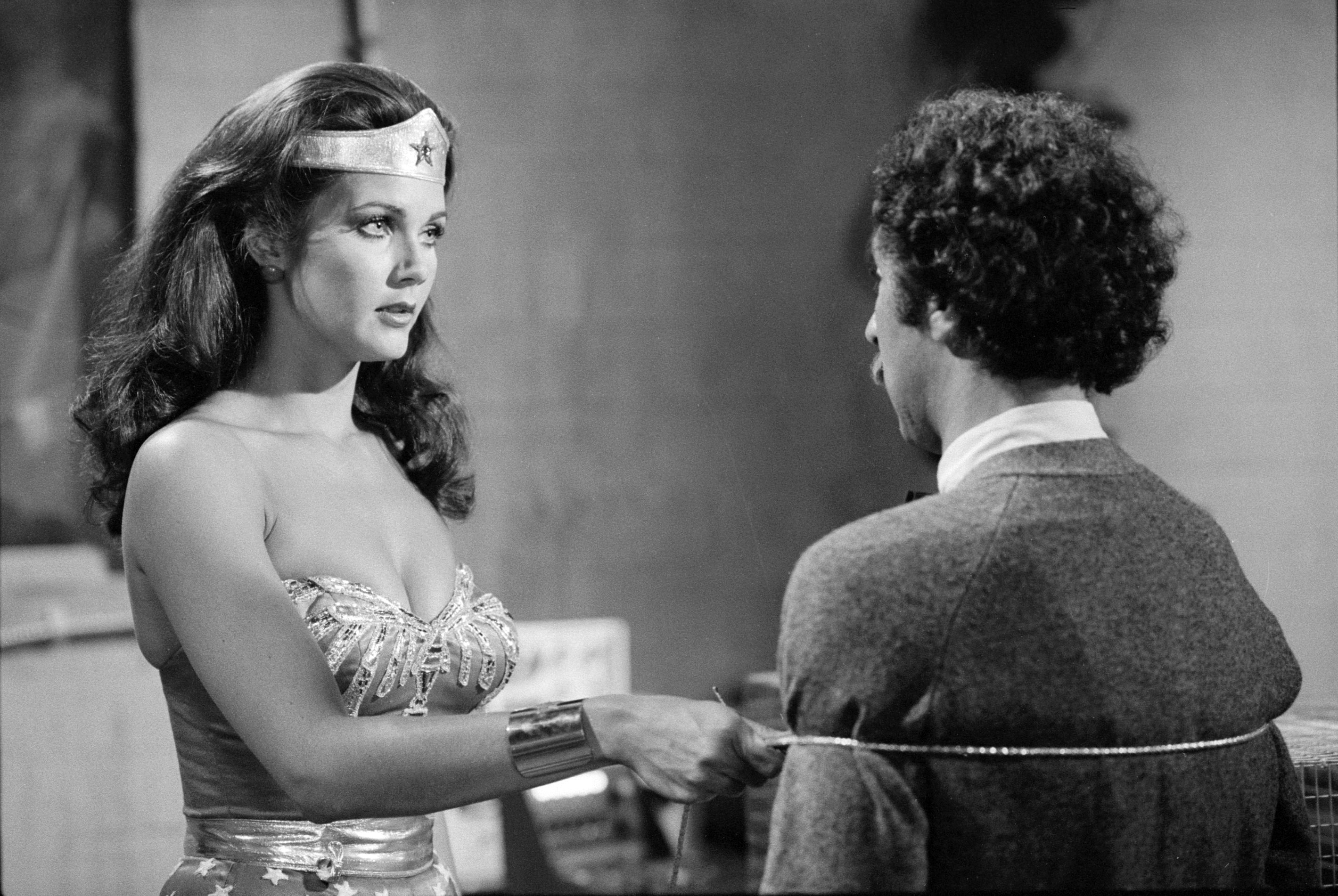 Lynda Carter as Wonder Woman with a man