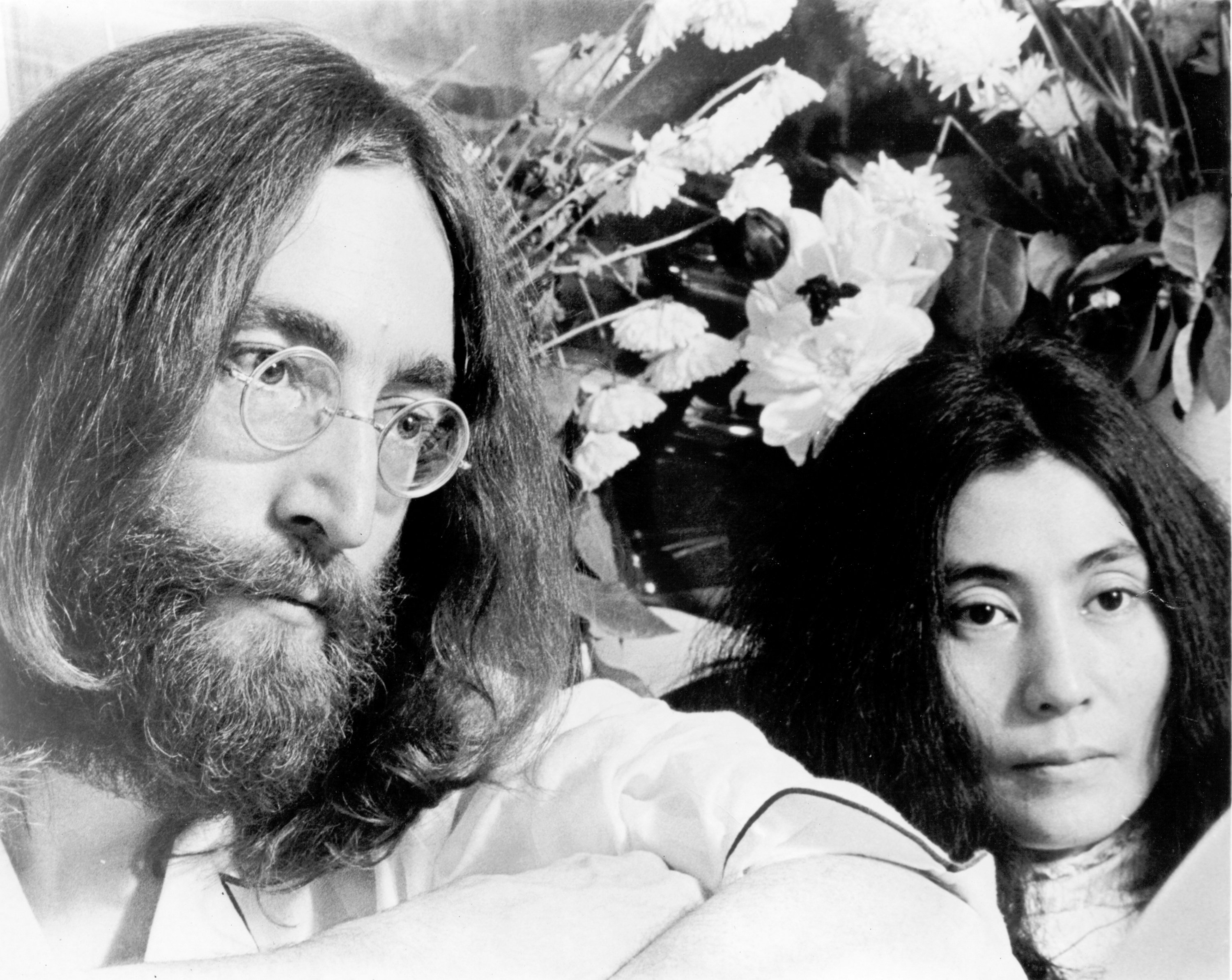John Lennon and Yoko Ono with flowers