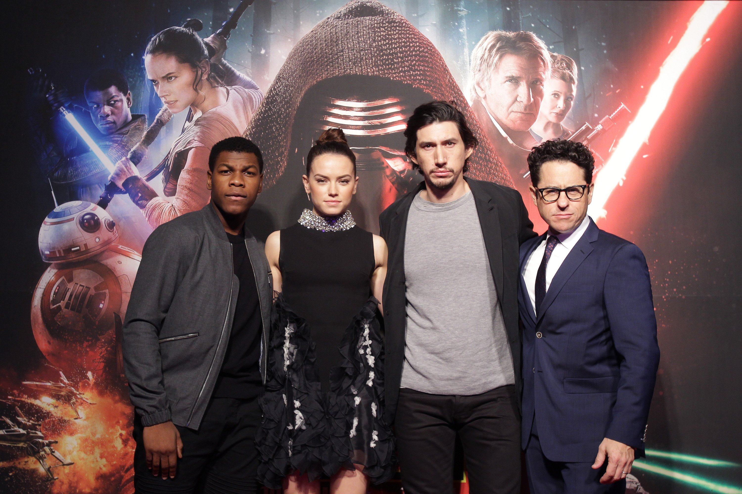 John Boyega, Daisy Ridley, Adam Driver, and director J.J. Abrams of 'Star Wars: The Force Awakens'