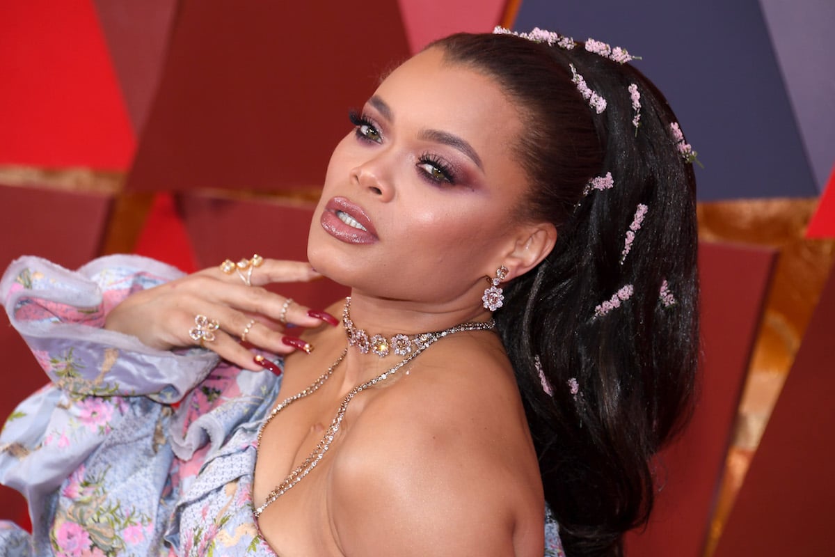 Andra Day posing on the red carpet floor