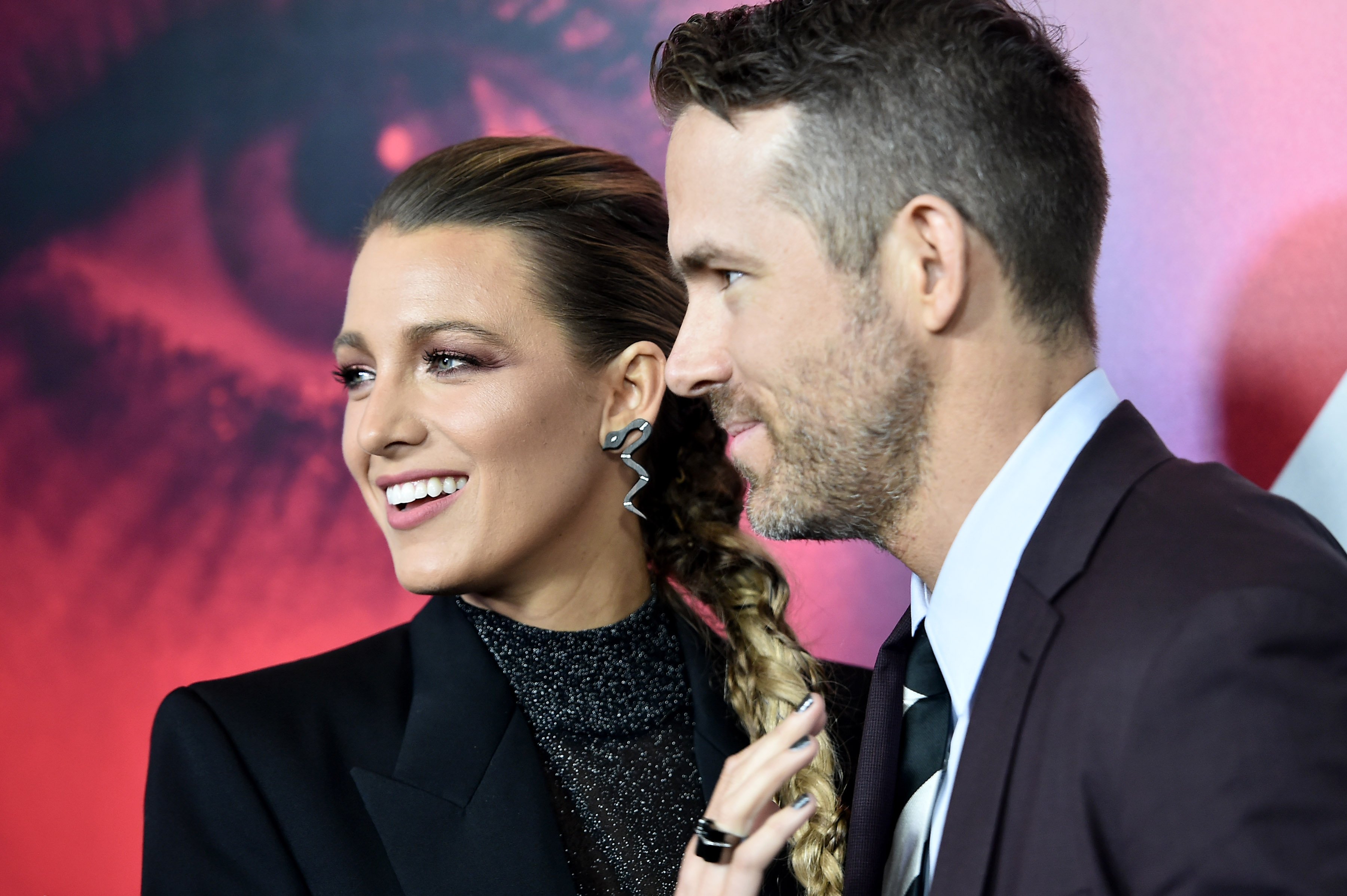 Blake Lively and Ryan Reynolds smile at the 'A Simple Favor' premiere.