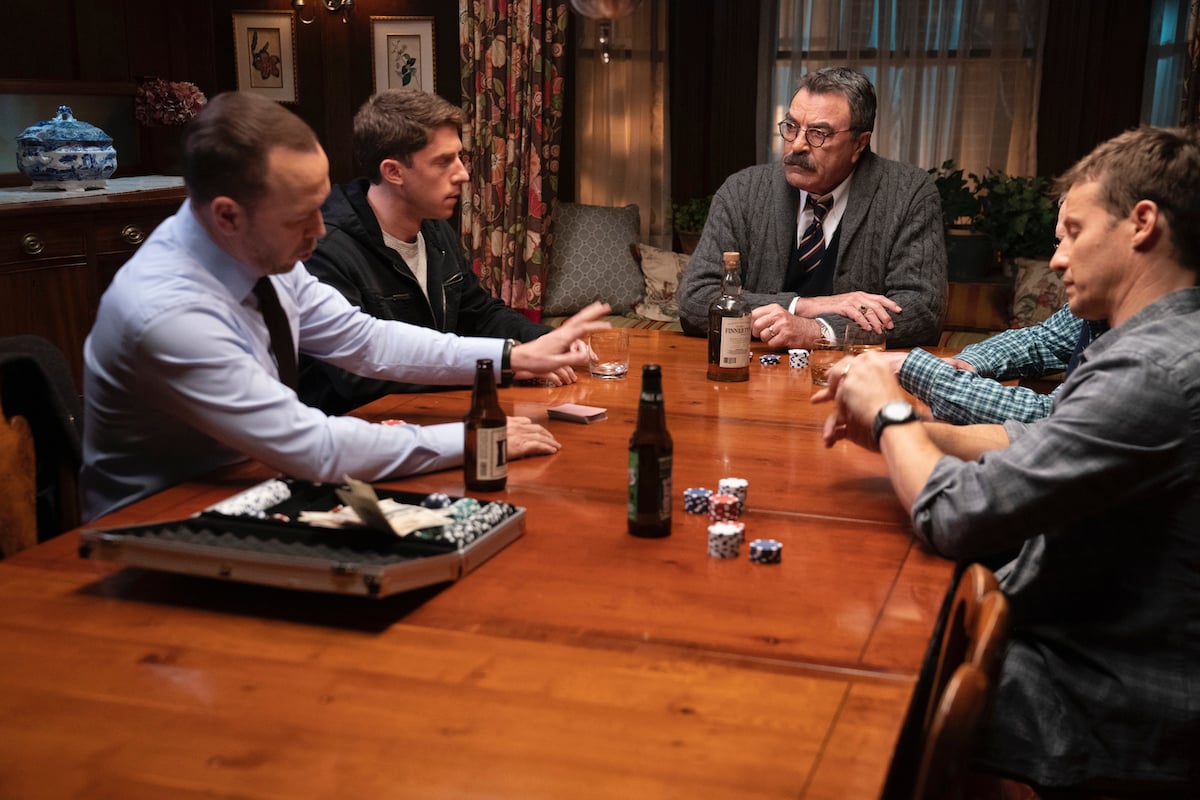 Donnie Wahlberg as Danny Reagan, Will Hochman as Joe Hill, Tom Selleck as Frank Reagan, Len Cariou as Henry Reagan, Will Estes as Jamie Reagan drink beer and liquor as they play poker on 'Blue Bloods'