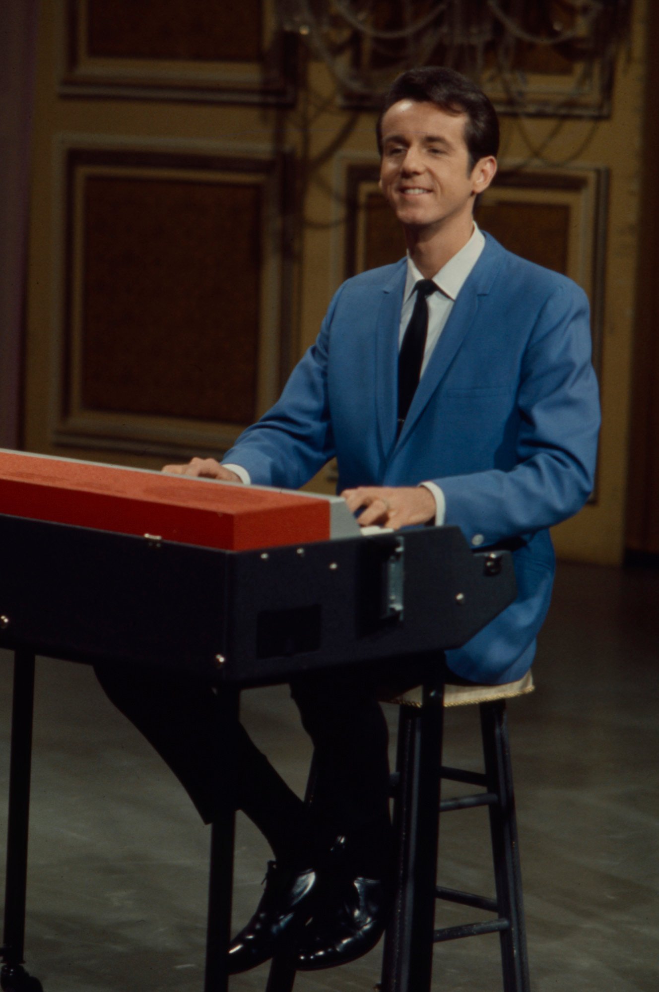 Bob Ralston smiling, playing the piano on 'The Lawrence Welk Show'