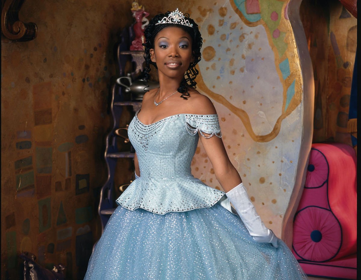 Brandy Norwood in a blue ballgown and tiara as Cinderella in 'Rodgers and Hammerstein's Cinderella' on ABC, 1997. Brandy's Cinderella dress was designed by the same costume designer who created the costumes for Amazon's 'Cinderella' starring Camila Cabello.