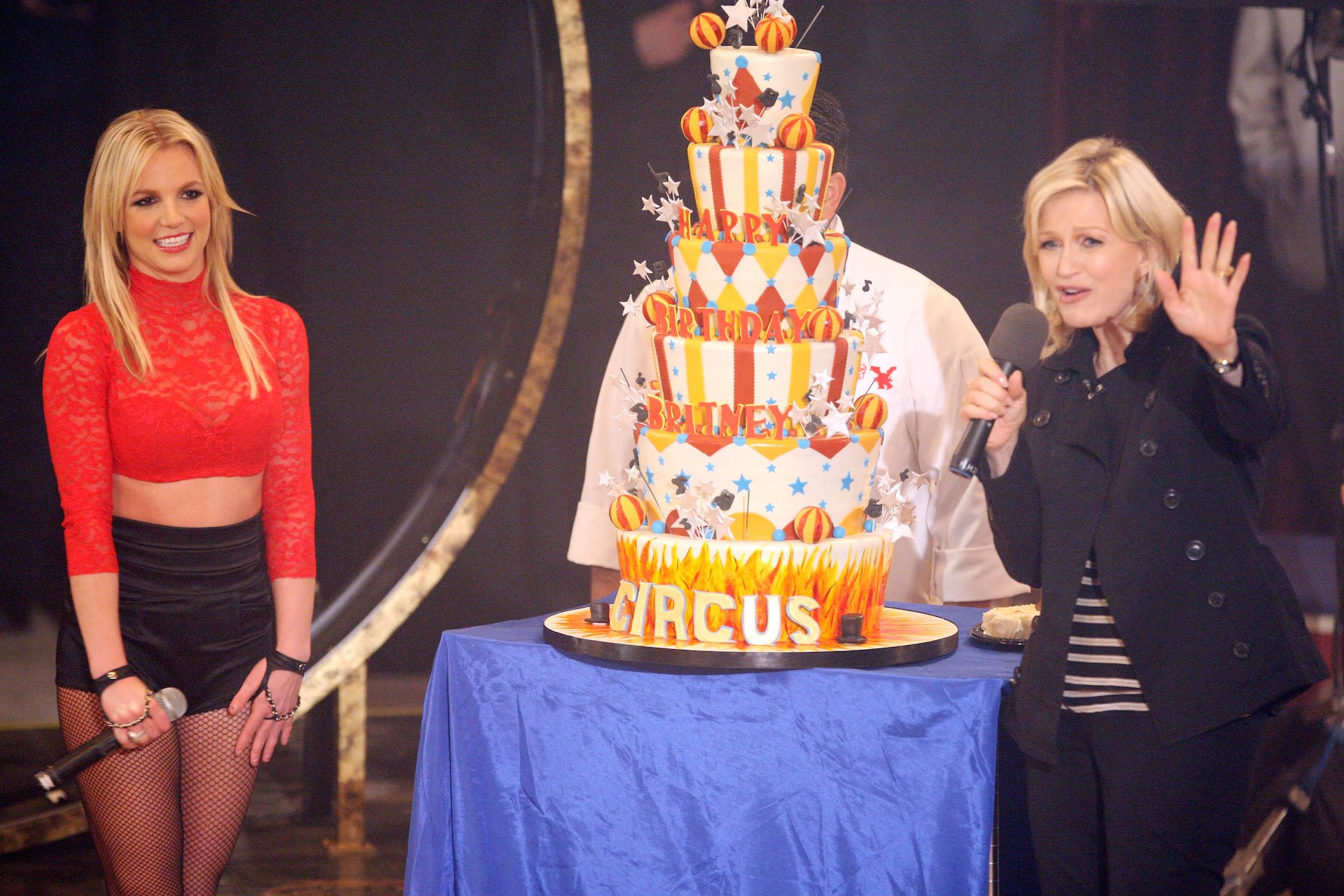 Britney Spears performing next to a birthday cake and Diane Sawyer