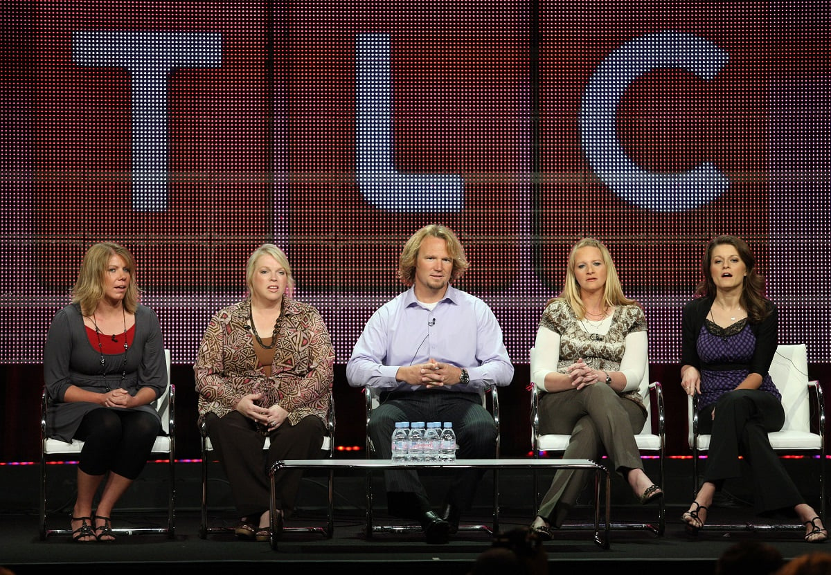 Meri, Janelle, Kody, Christine, and Robyn Brown sitting on a panel at a 2010 TCA Press Tour with a giant TLC logo behind them