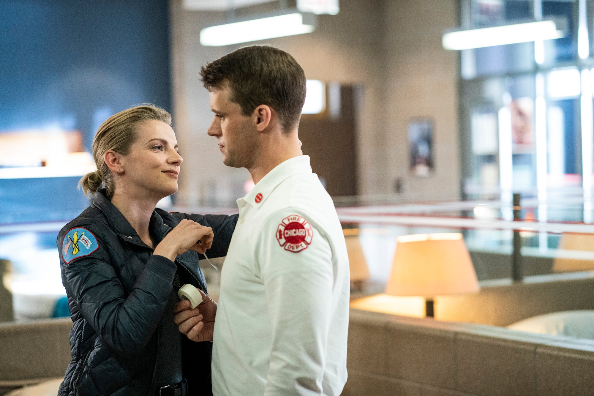 (L-R) Kara Killmer as Sylvie Brett, Jesse Spencer as Matthew Casey looking at each other as Brett treats Casey