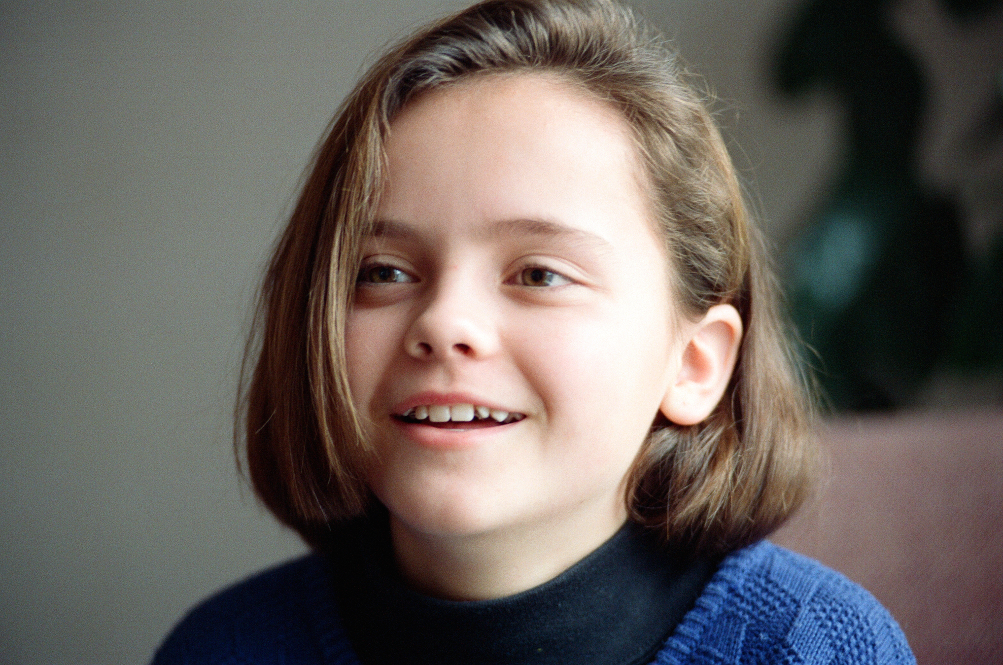 11-year-old Christina Ricci smiling at the camera