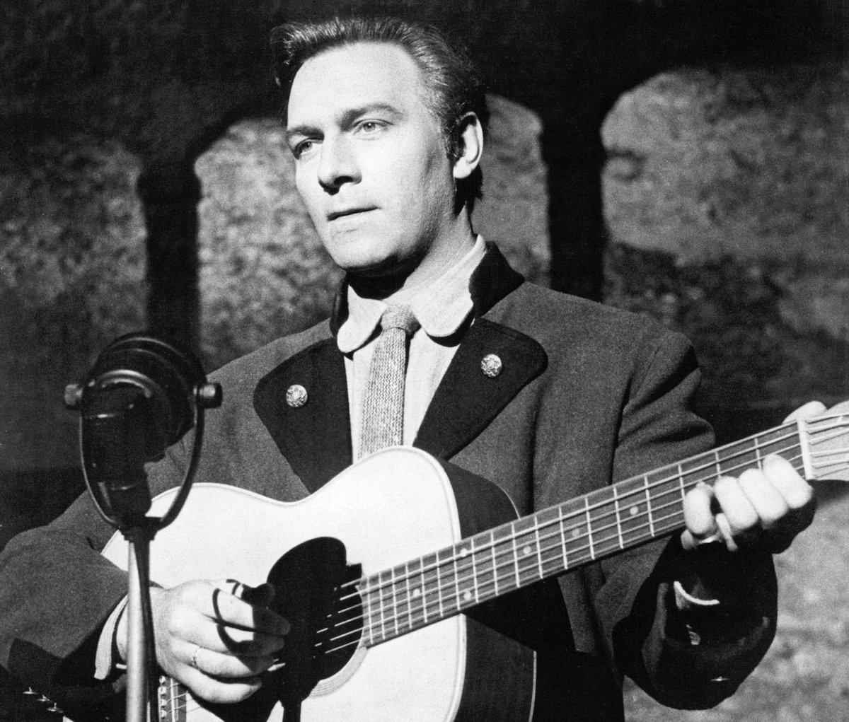 Christopher Plummer, as Captain Georg von Trapp, playing a guitar in 'The Sound of Music' | Silver Screen Collection/Getty Images