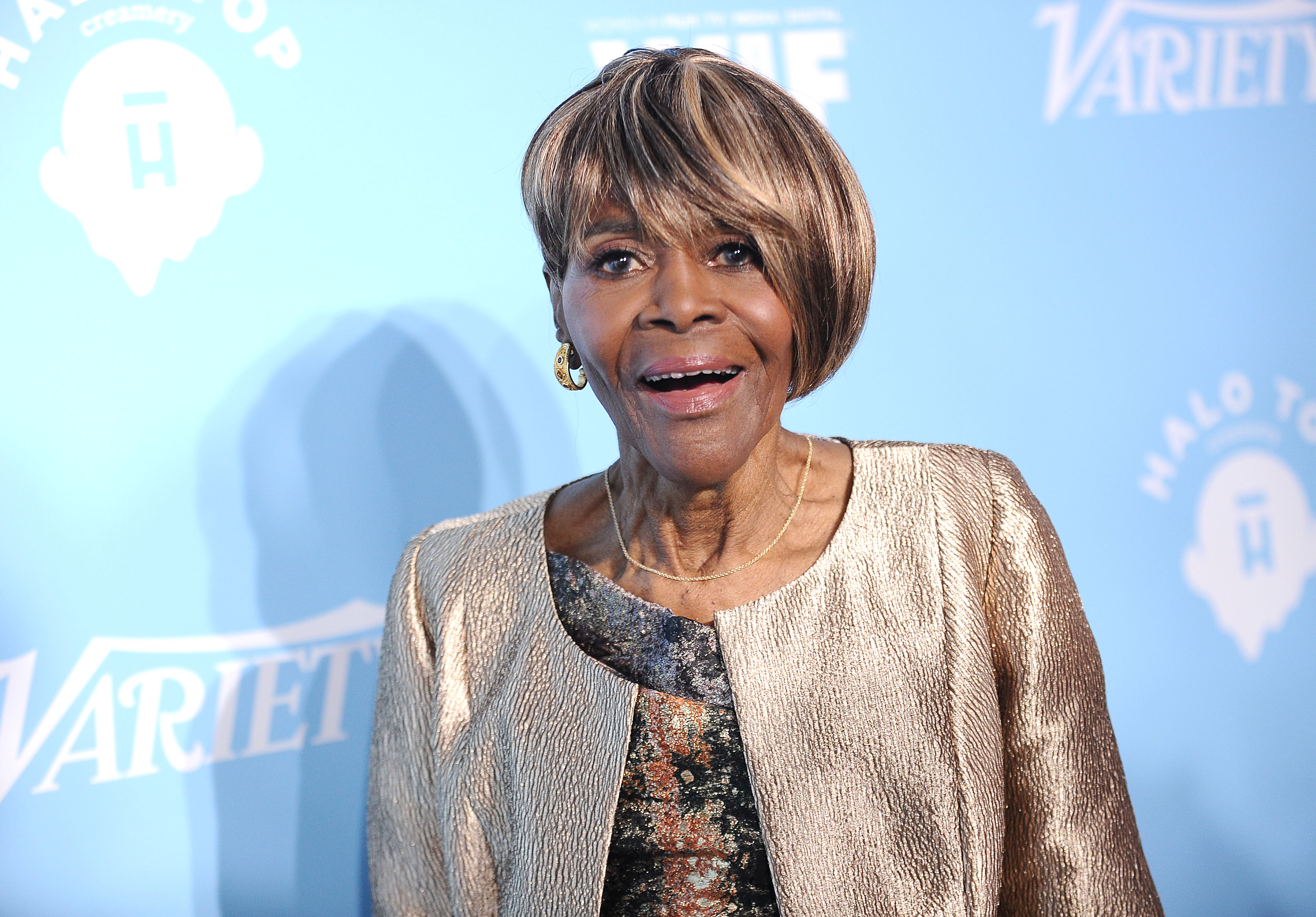 Cicely Tyson wearing a silver jacket.