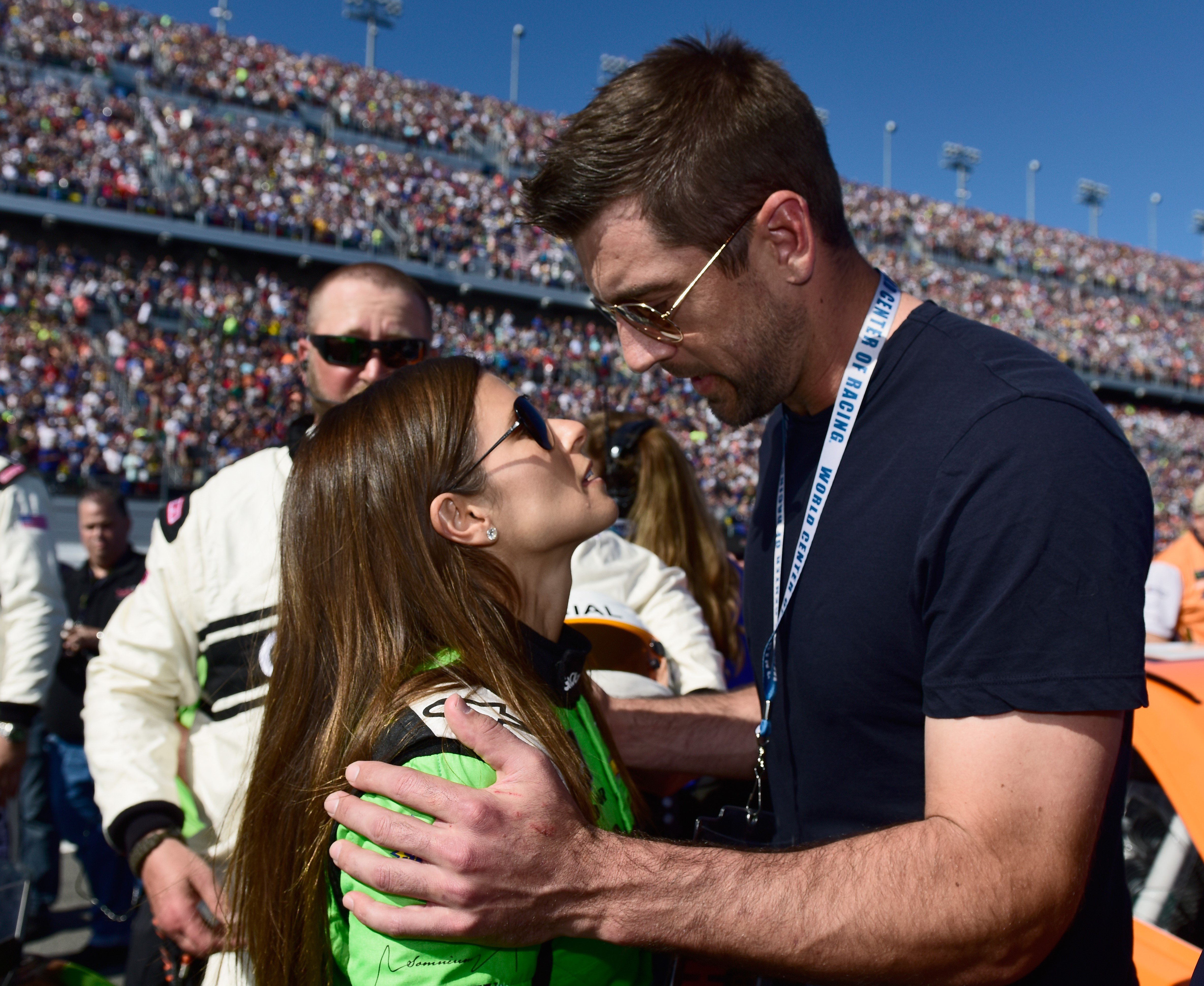 Danica Patrick standing with Aaron Rodgers before Monster Energy NASCAR Cup Series 60th Annual Daytona 500