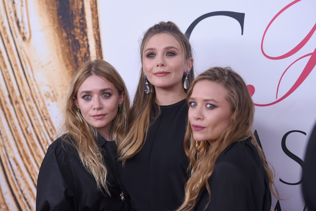 Elizabeth Olsen (center) and Mary-Kate and Ashley Olsen at the 2016 CFDA Fashion Awards