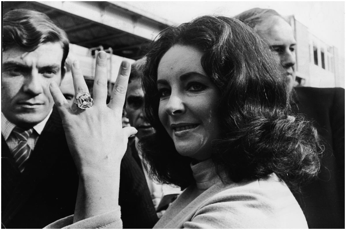 British-born actress Elizabeth Taylor shows off the 33.19 carat diamond ring given to her by husband Richard Burton. 