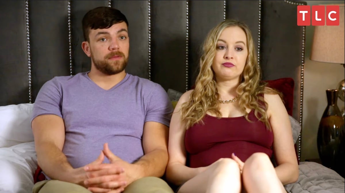 90 Day Fiancé stars Andrei Castravet and Elizabeth Potthast talk to producers on a bed