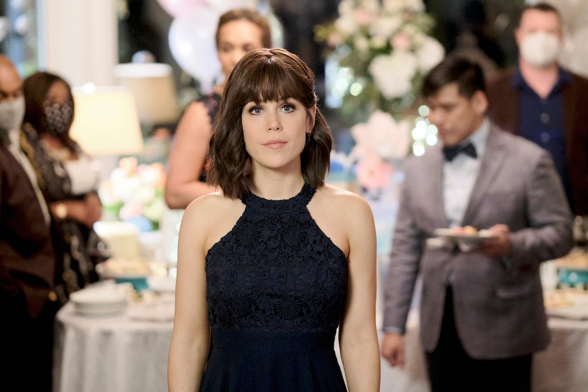 Erin Krakow with bangs and wearing a black halter dress in It Was Always You