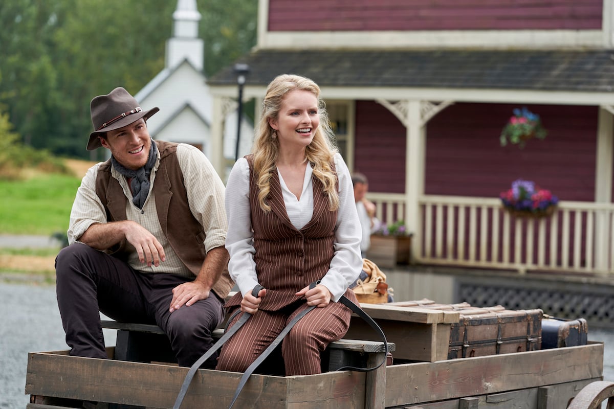Faith sitting next to a man in a wagon in When Calls the Heart season 8 premiere episode