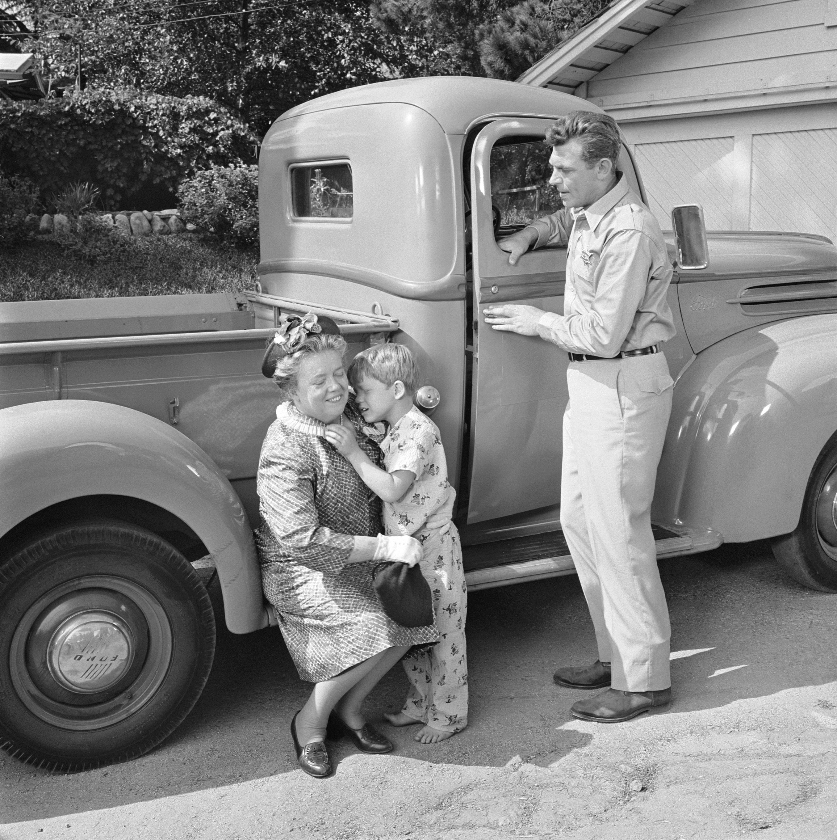 Frances Bavier as Aunt Bee, Ron Howard as Opie Taylor, and Andy Griffith as Sheriff Andy Taylor in a scene from 'The Andy Griffith Show,' 1960