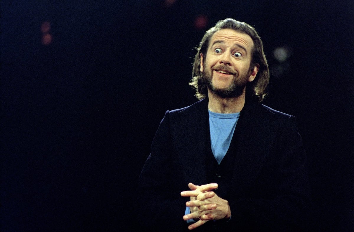 Host George Carlin wears a shirt and blazer during the monologue on October 11, 1975 on 'Saturday Night Live'