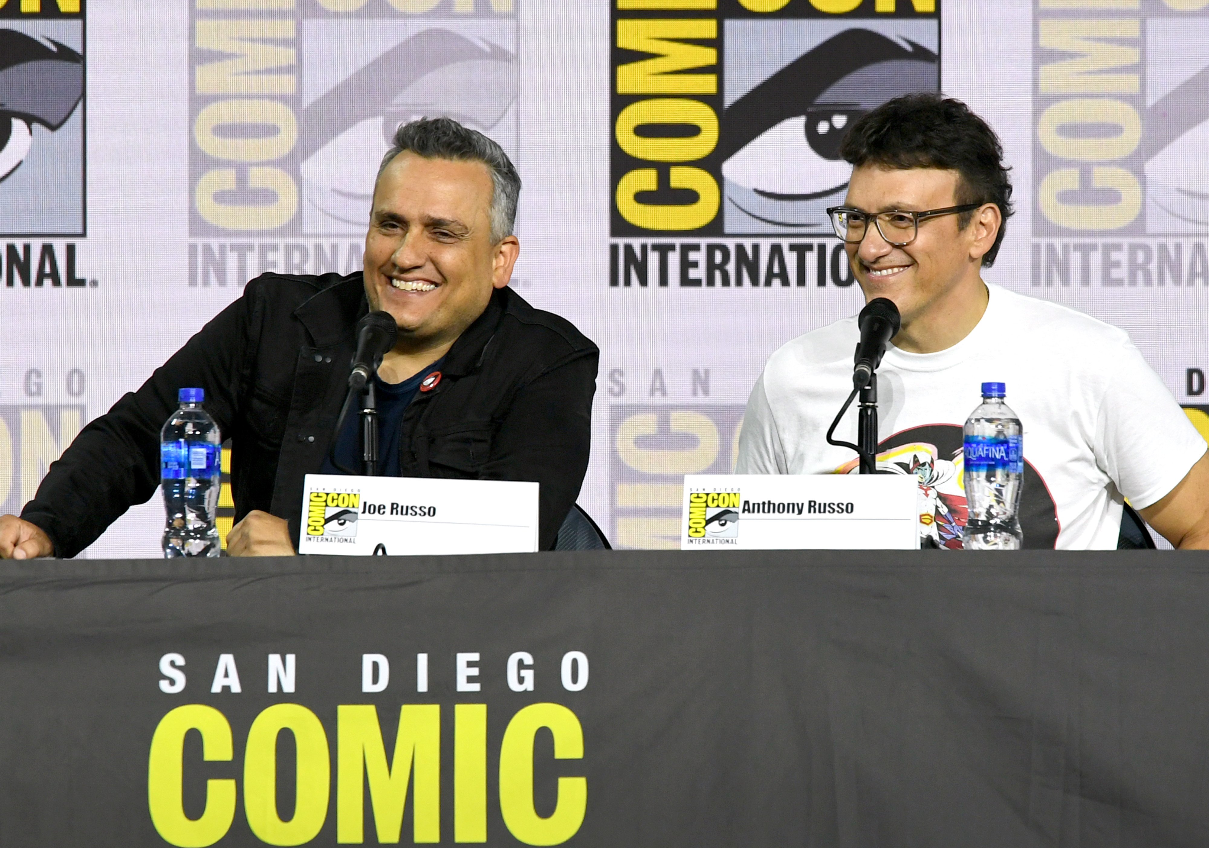 Joe Russo and Anthony Russo speak at the Writing "Avengers: Endgame" Panel during 2019 Comic-Con International.