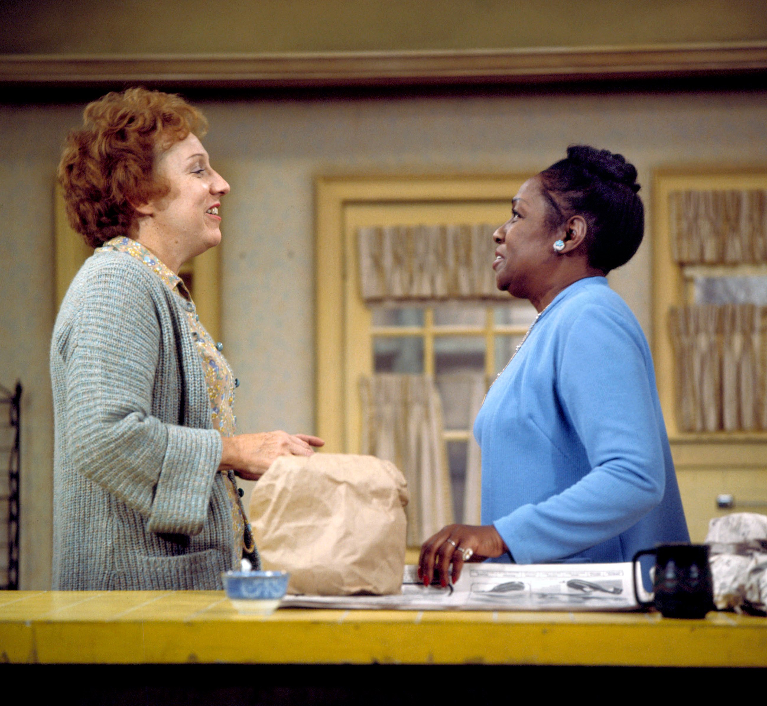 (L to R) Jean Stapleton as Edith Bunker and Isabel Sanford as Louise Jefferson say goodbye in 'The Jeffersons Move On Up' Episode of 'All in the Family'