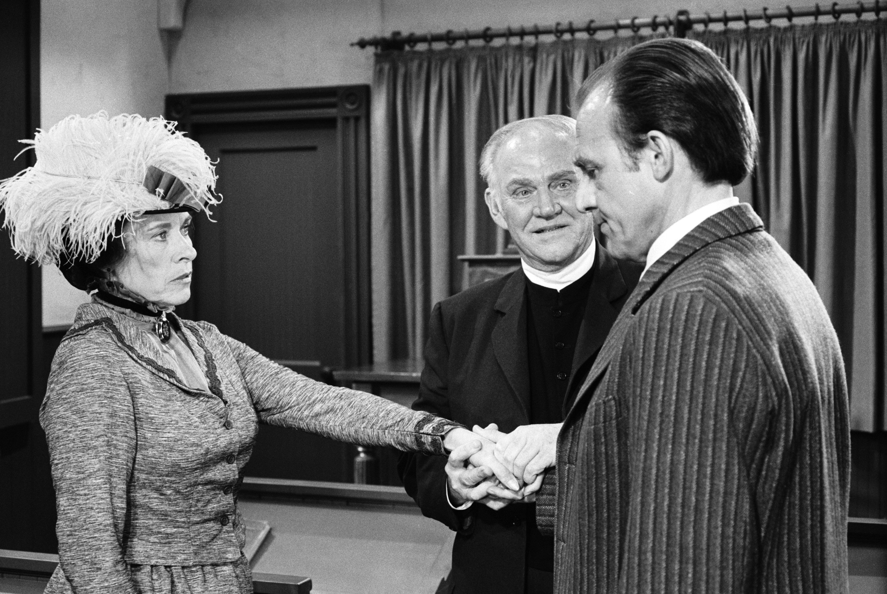 (L to R): Katherine MacGregor as Harriet Oleson, Dabs Greer as Reverend Alden, and Richard Bull as Nels Oleson in a scene from 'Little House on the Prairie,' 1975
