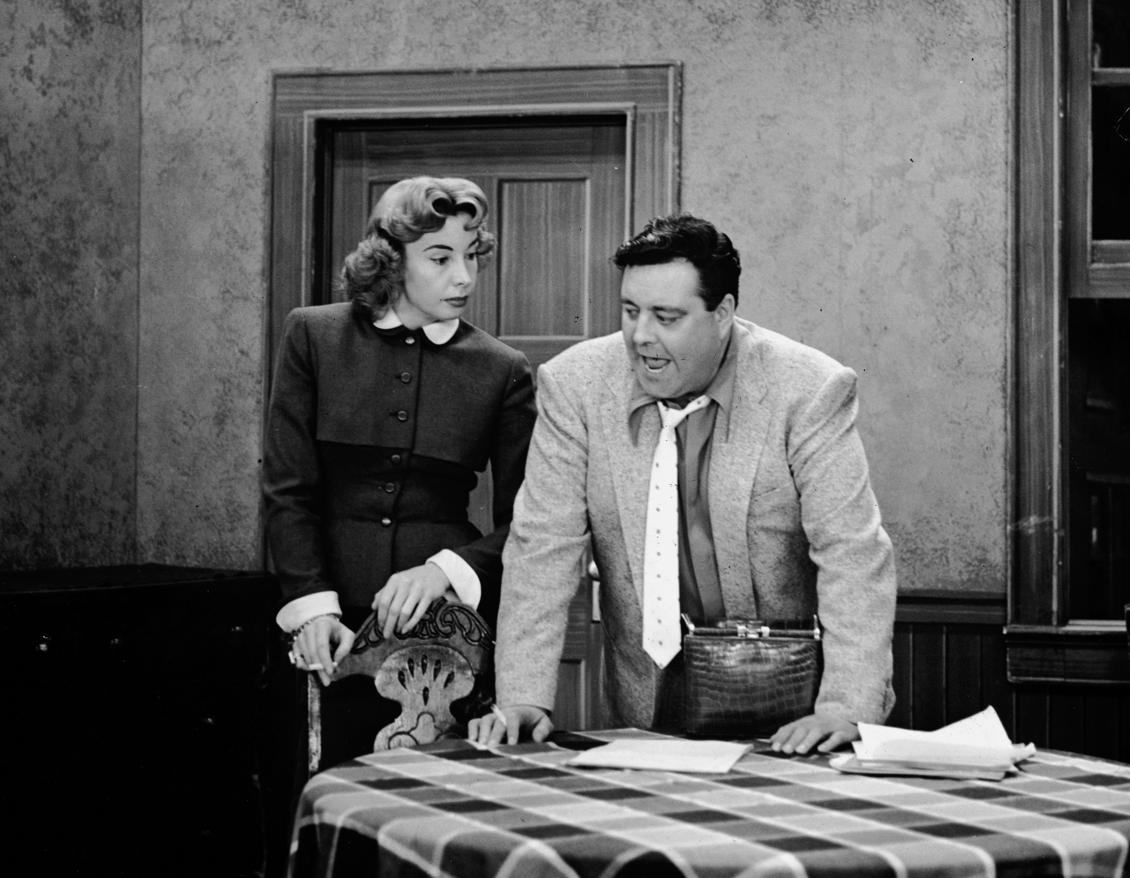 Audrey Meadows, left, as Alice Kramden and Jackie Gleason as her husband Ralph in a scene from 'The Honeymooners'
