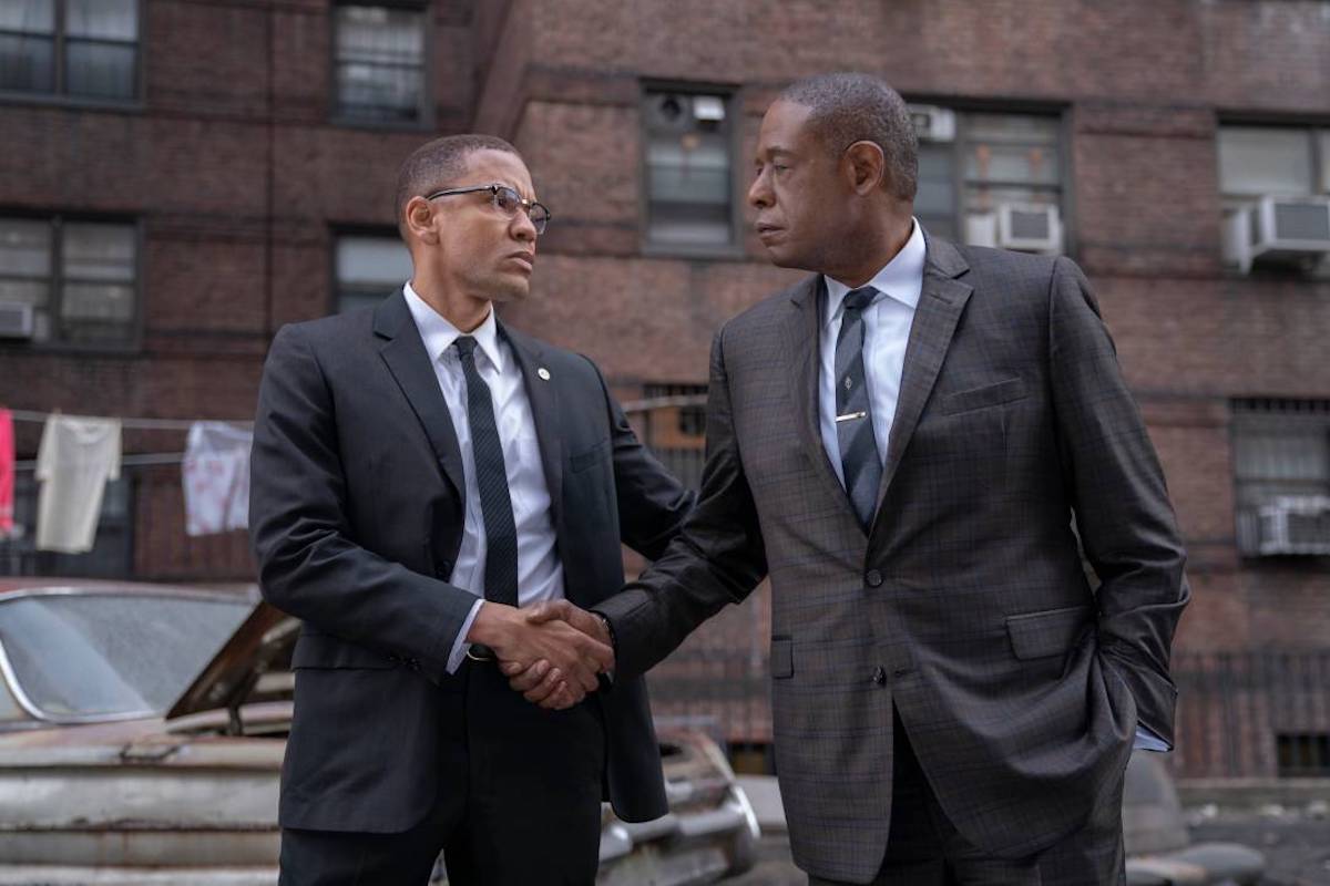 Malcolm X (Nigél Thatch) and Johnson (Forest Whitaker) make a deall