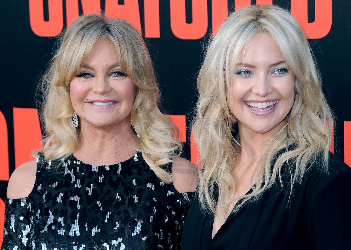 Goldie Hawn and Kate Hudson smile on the red carpet of the 'Snatched' premiere at the Regency Village Theatre on May 10, 2017 in Westwood, California | Barry King/Getty Images