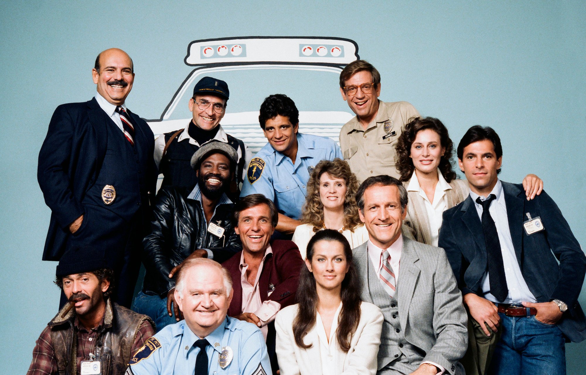 Cast of 'Hill Street Blues' in front of a light blue background with an illustration of a police car outline