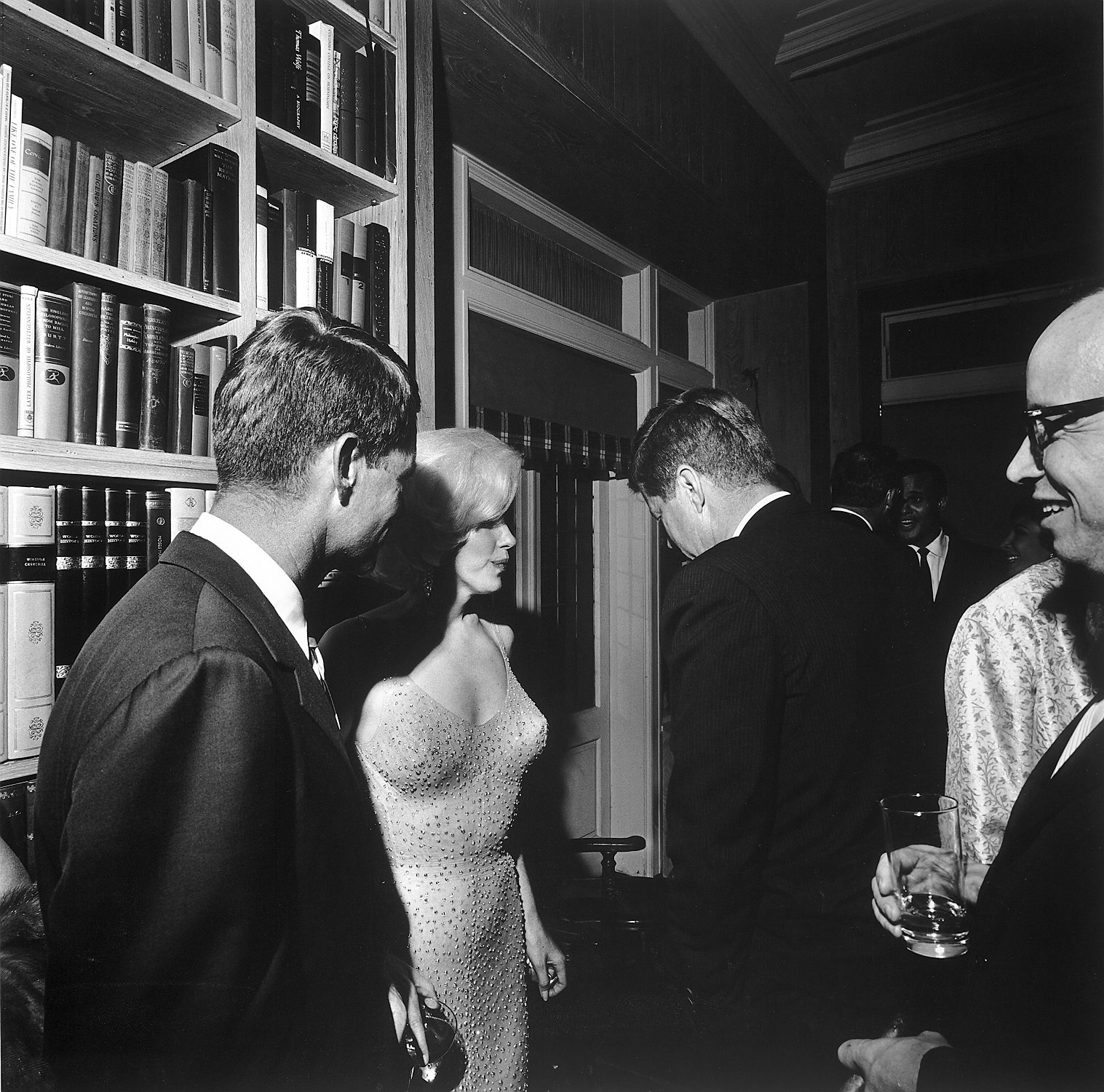 Marilyn Monroe seen talking to John F. Kennedy and Robert Kennedy in an undated photo 