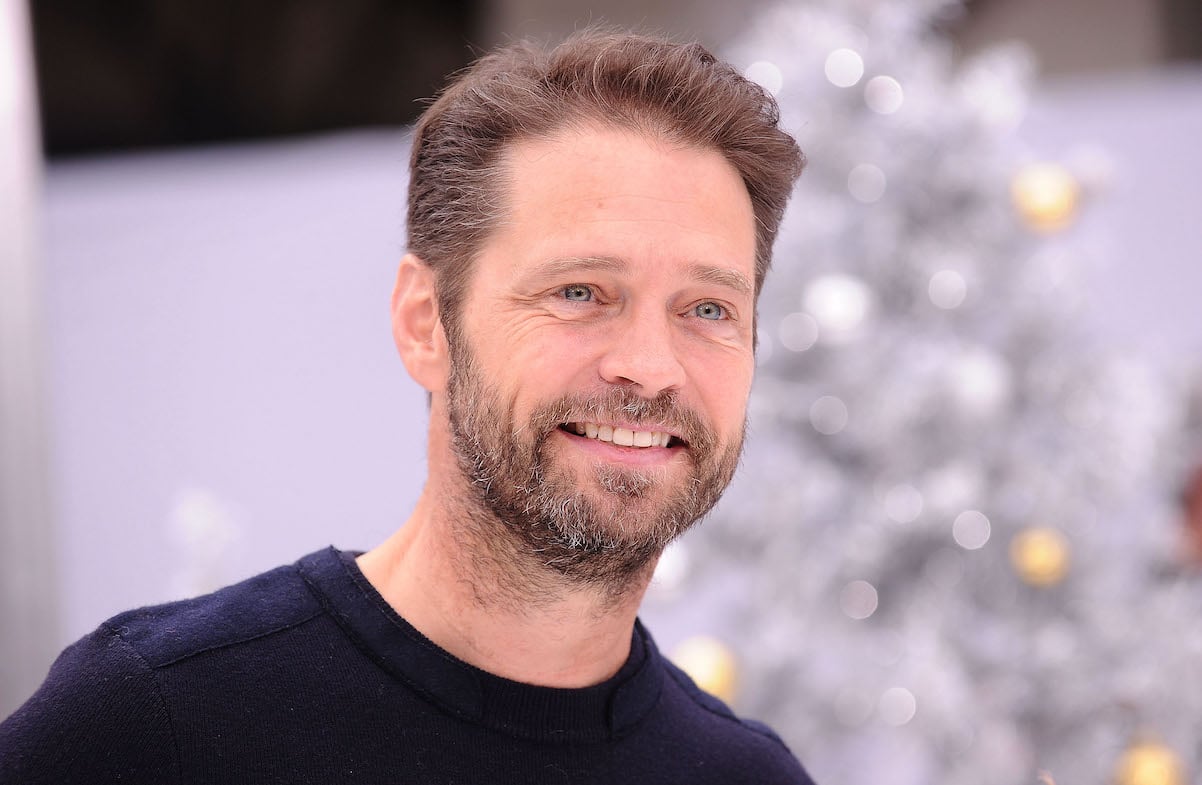 Jason Priestley smiles for photographers at the premiere of 'The Star'