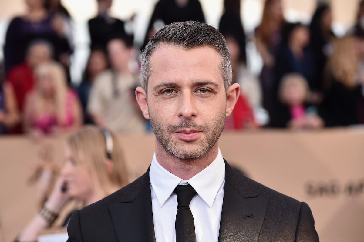 Jeremy Strong poses for photographers as he walks the red carpet at the 2016 Screen Actors Guild Awards