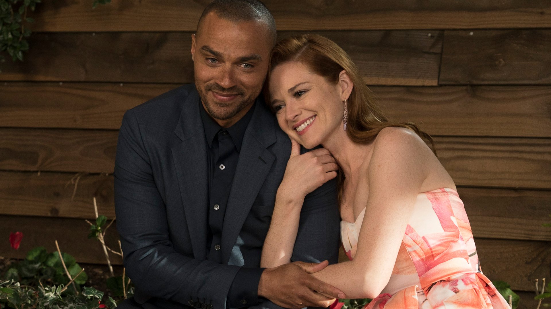 Jesse Williams as Jackson Avery and Sarah Drew as April Kepner hugging at the wedding in the 'Grey's Anatomy' Season 14 finale.