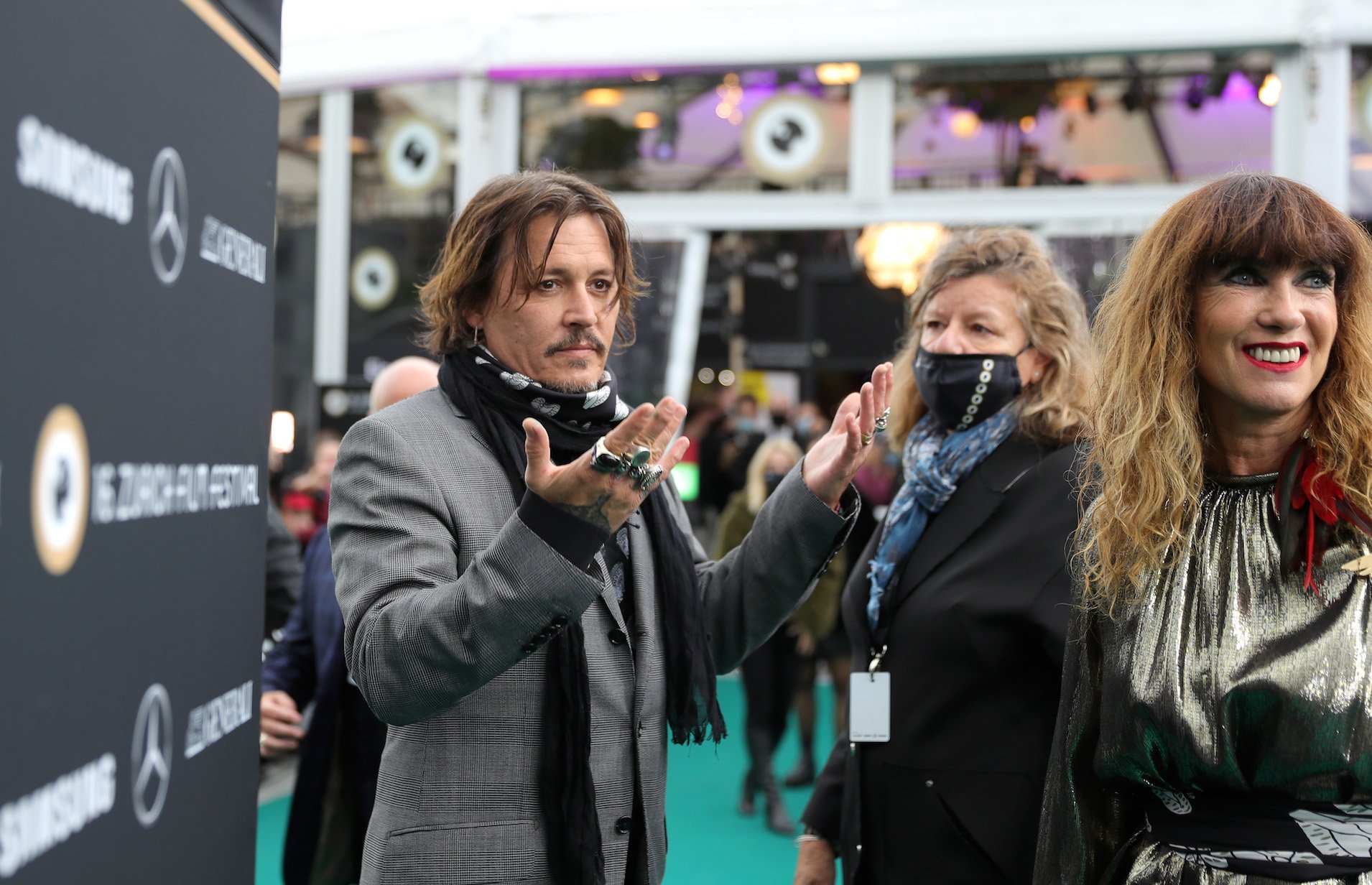 Johnny Depp in a crowd with his hands out