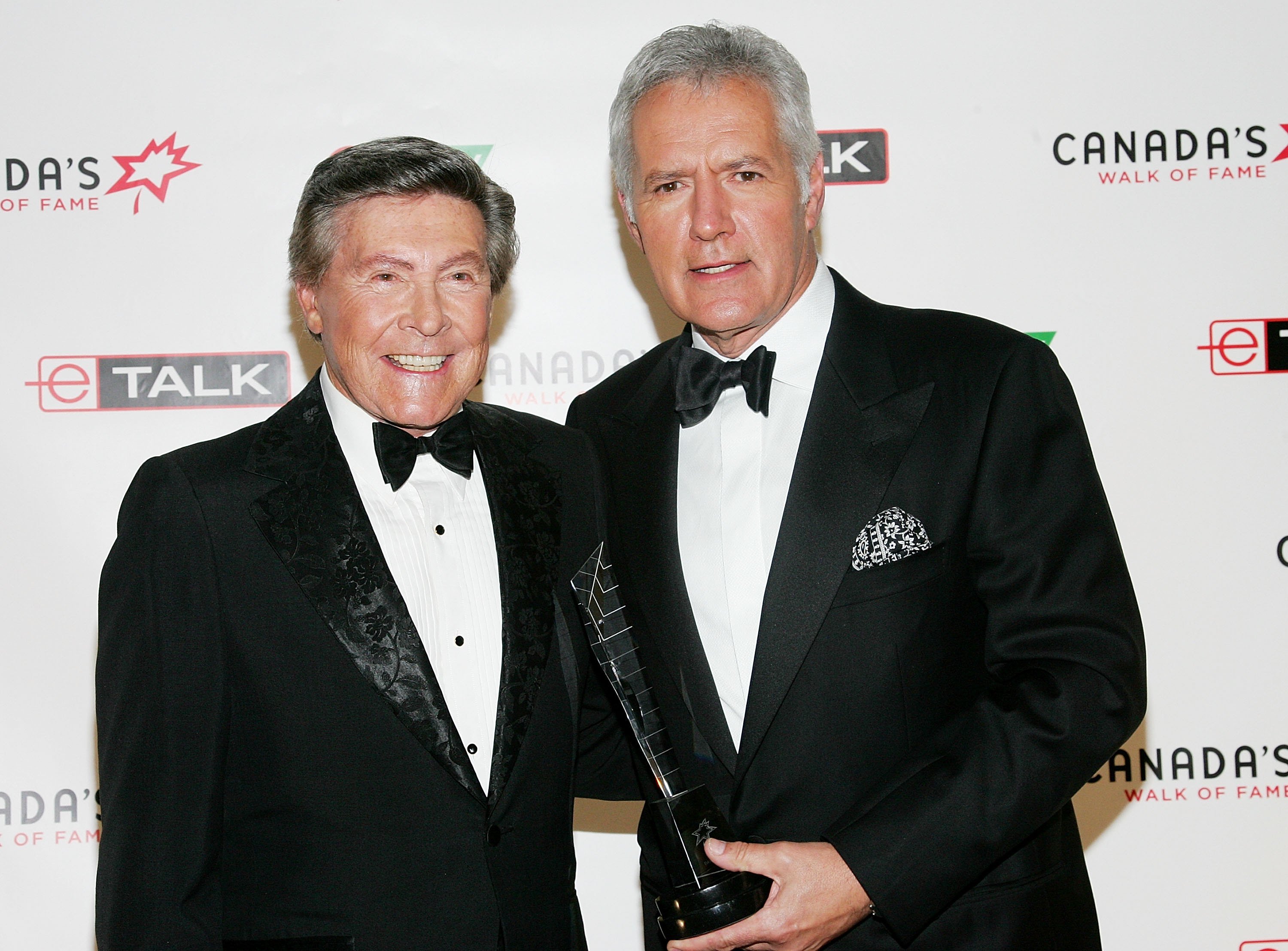 Presenter Johnny Gilbert and honoree Alex Trebek of 'Jeopardy!' attend Canada's Walk Of Fame Gala sponsored by Chanel at the HummingBird Centre