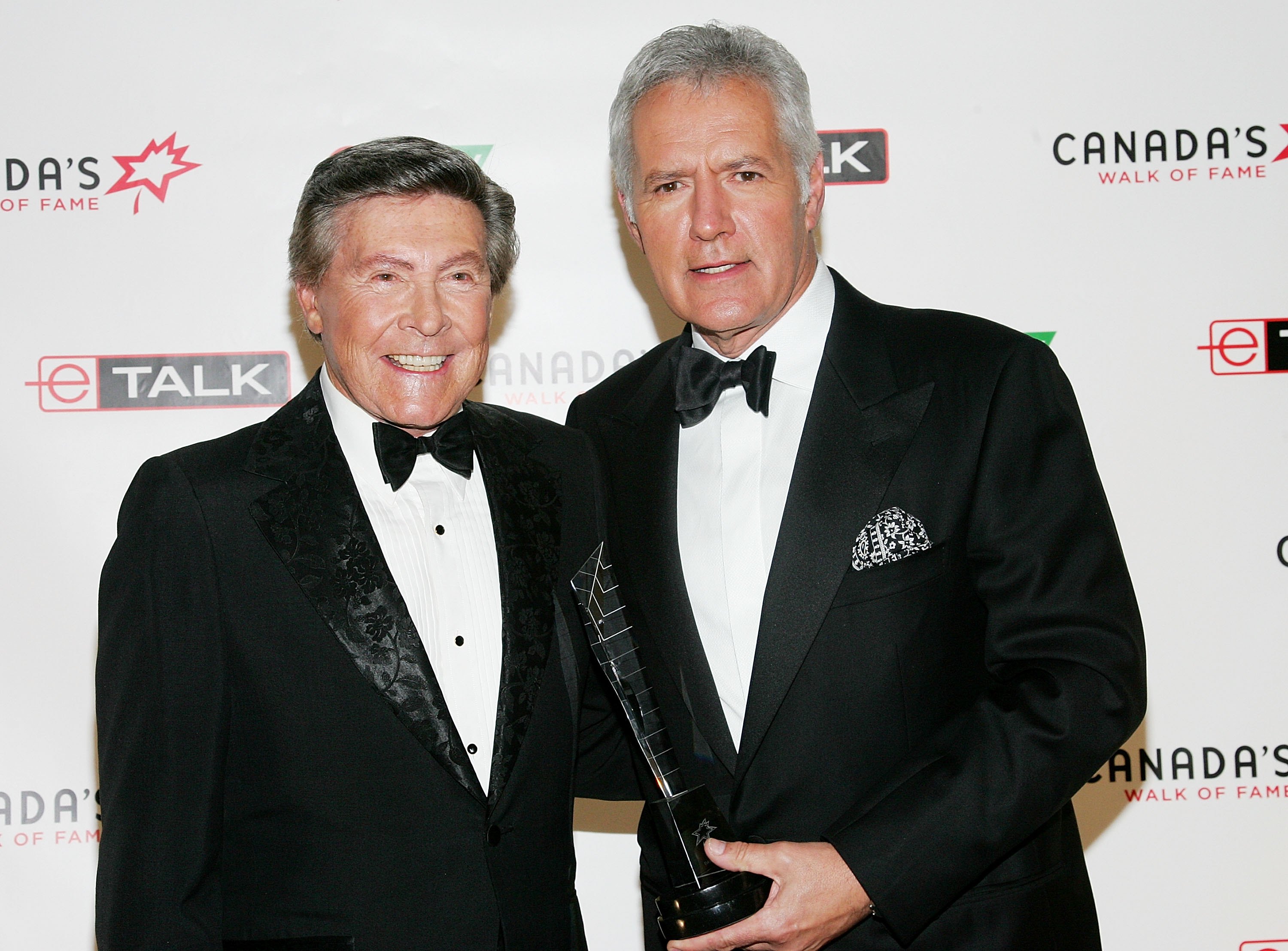 Presenter Johnny Gilbert and honoree Alex Trebek of 'Jeopardy!' attend Canada's Walk Of Fame Gala sponsored by Chanel at the HummingBird Centre 
