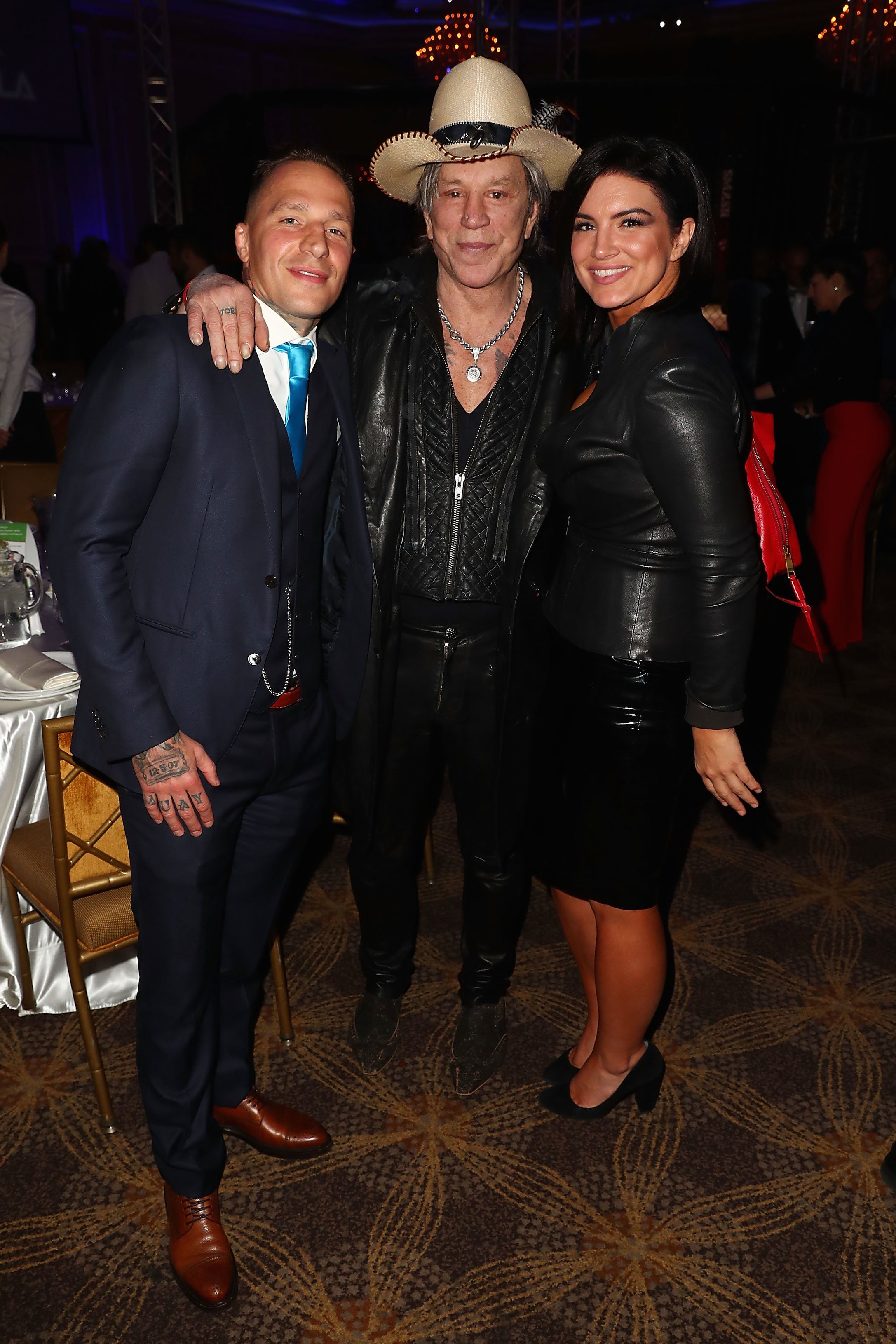 Kevin Ross, Mickey Rourke, and Gina Carano attend an event