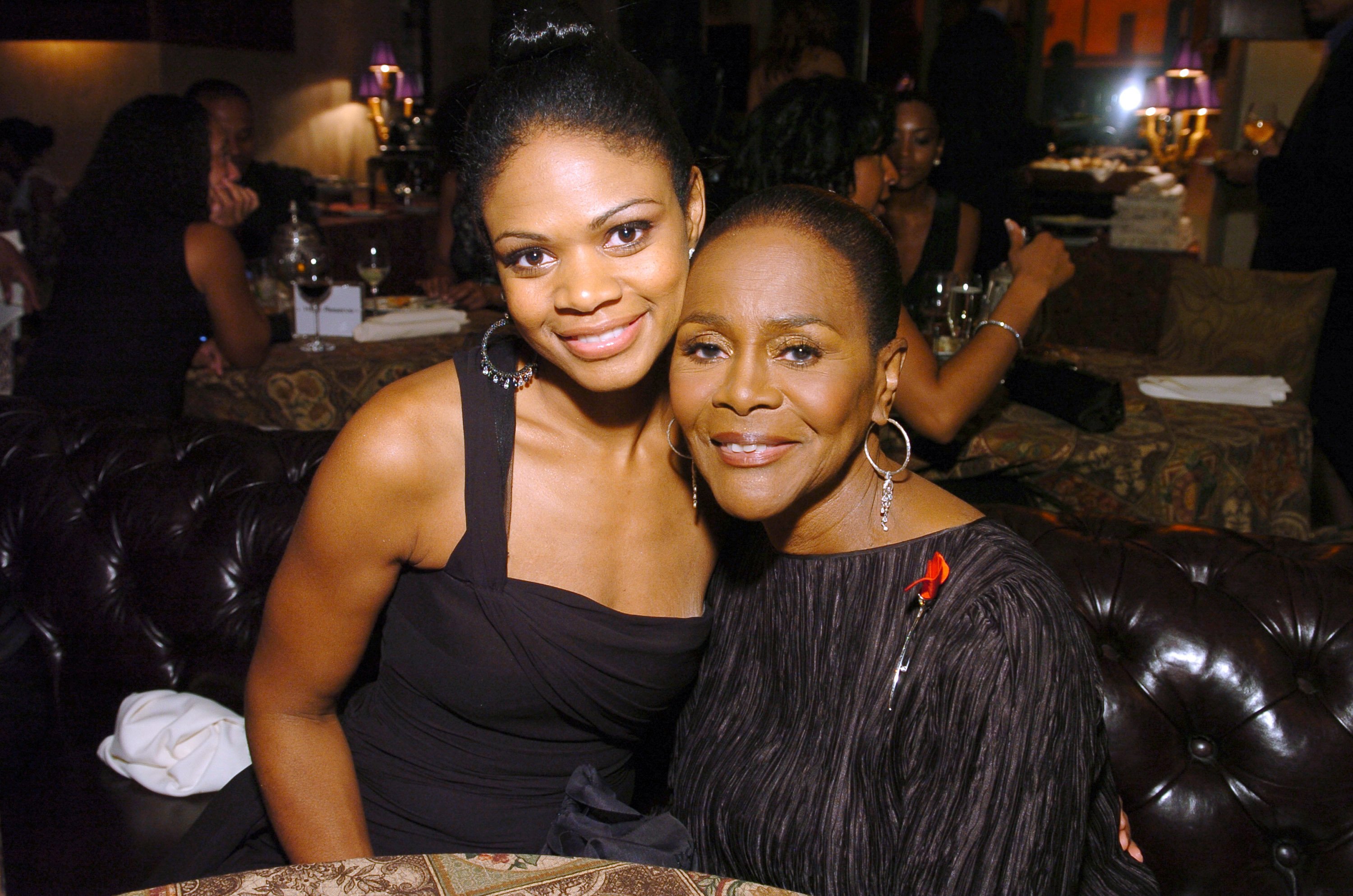 Kimberly Elise and Cicely Tyson smiling while wearing black dresses.