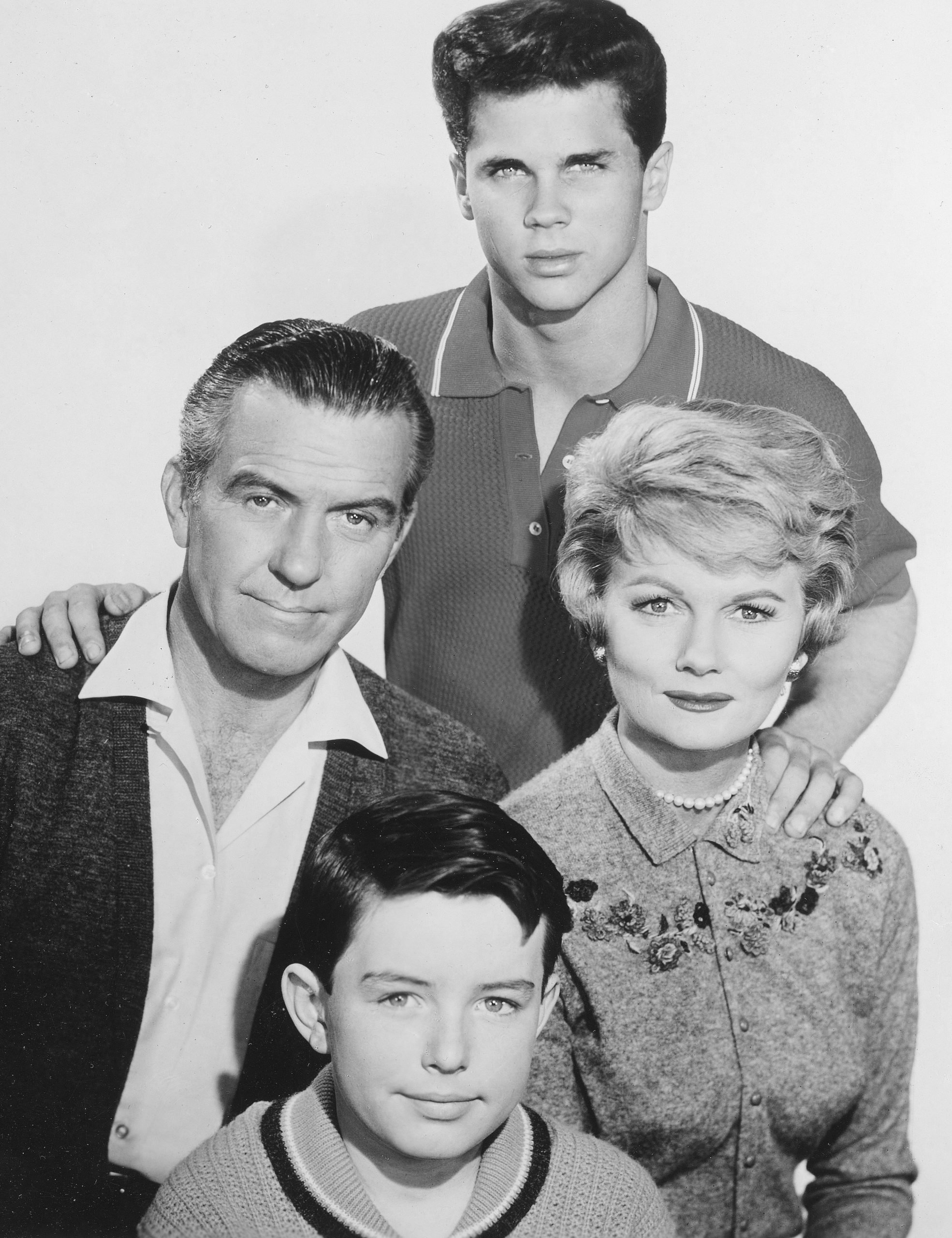 Jerry Mathers as Beaver Cleaver, Hugh Beaumont as Ward Cleaver, Barbara Billingsley as June Cleaver and Tony Dow as Wally Cleaver in a promotional photo for 'Leave It to Beaver'
