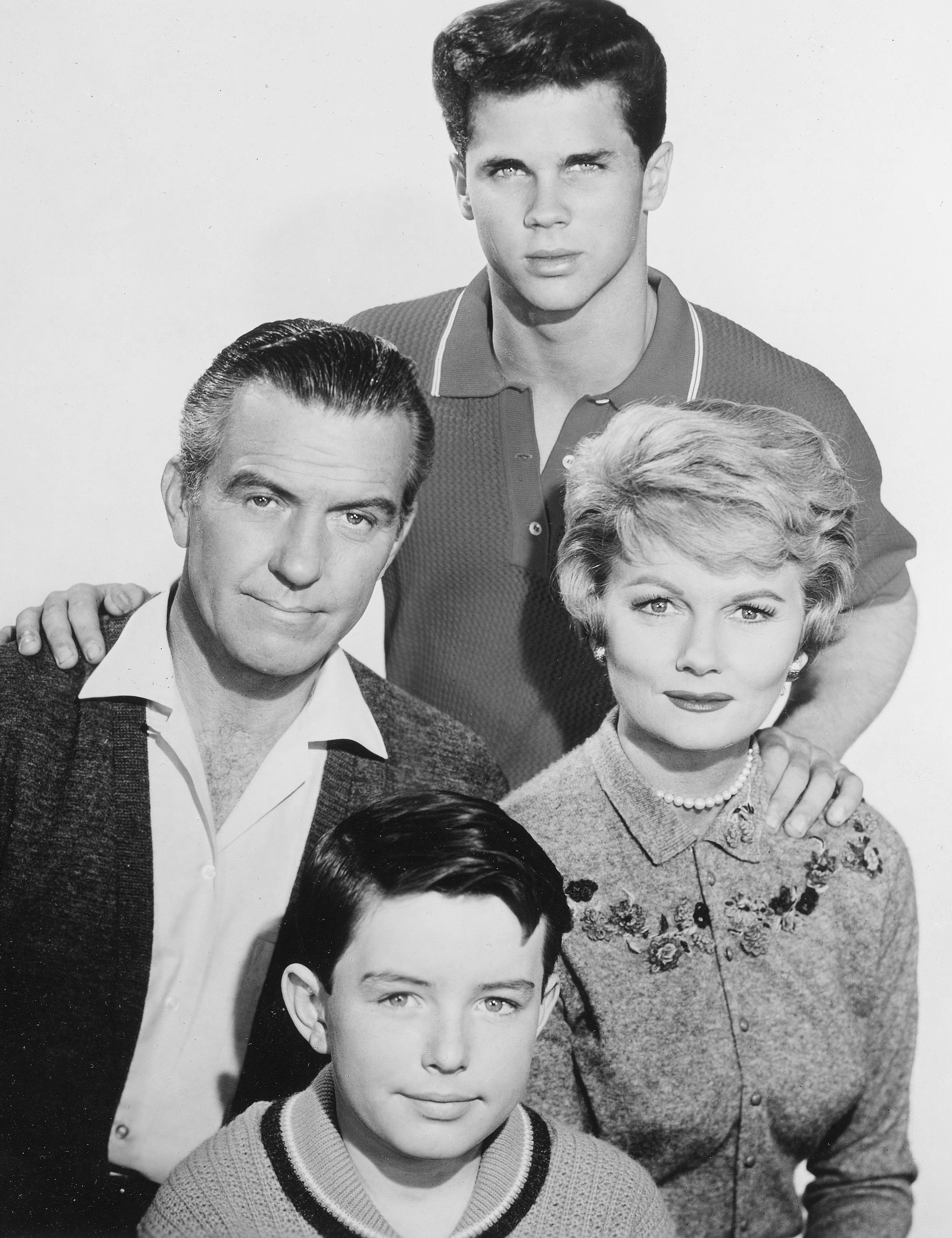 Jerry Mathers as Beaver Cleaver, Hugh Beaumont as Ward Cleaver, Barbara Billingsley as June Cleaver and Tony Dow as Wally Cleaver in a promotional photo for 'Leave It to Beaver'