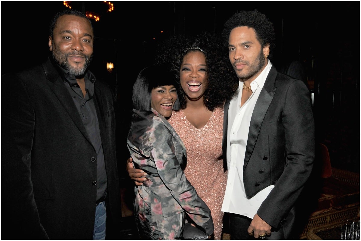 Lee Daniels, Cicely Tyson, Oprah Winfrey, and Lenny Kravitz pose and smile at an event.