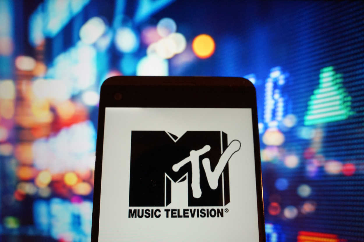 In this photo illustration, the logo of music television is seen displayed on a smartphone