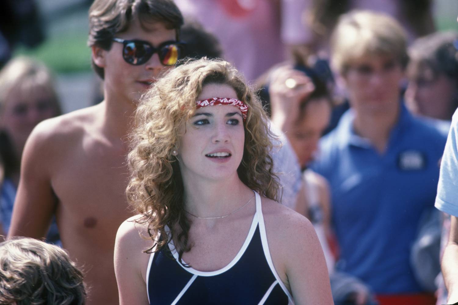 Melissa Gilbert wearing a red headband and a black and white top.
