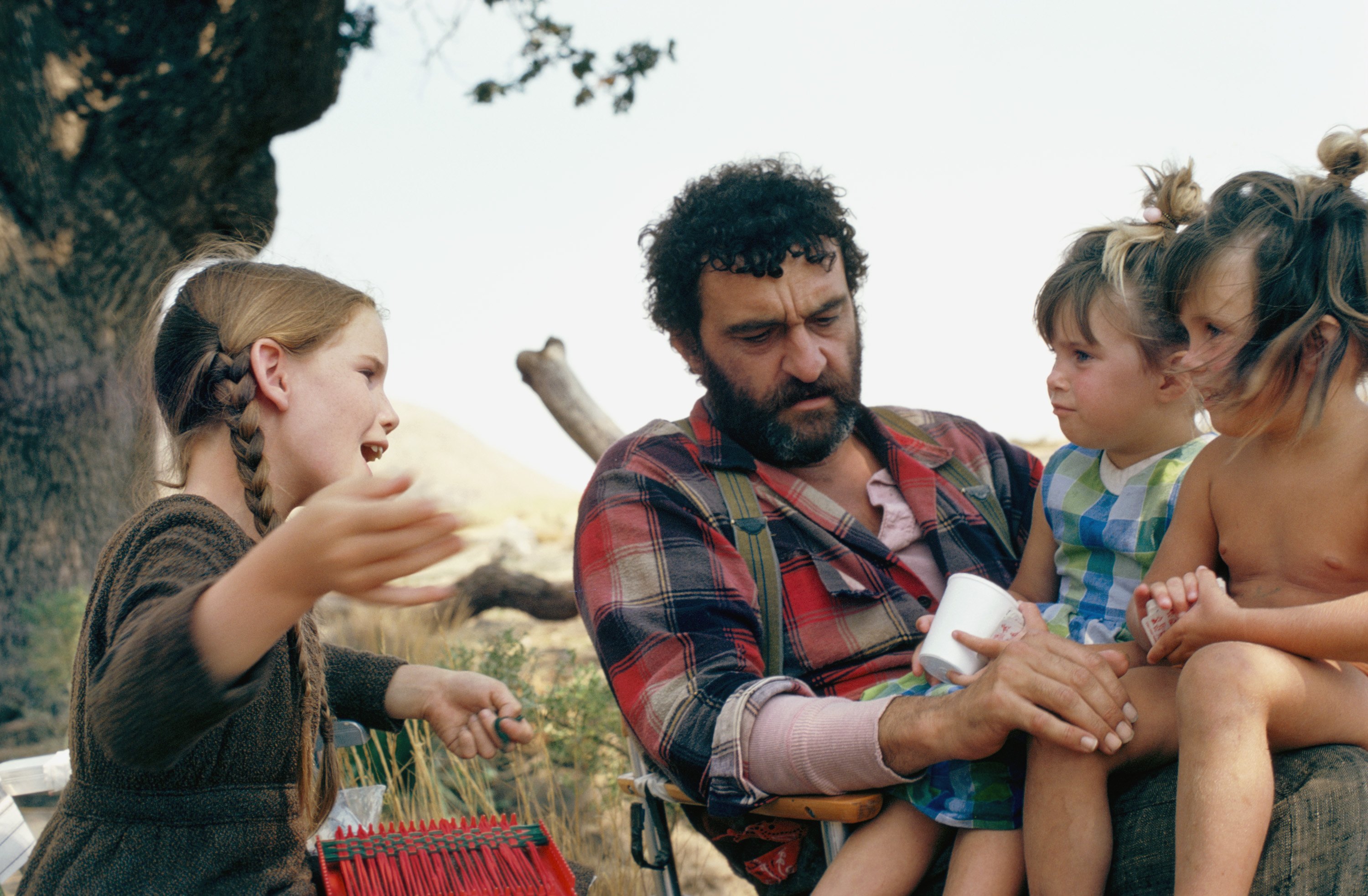 Melissa Gilbert as Laura Ingalls Wilder, Victor French as Isaiah Edwards, Lindsay and Sydney Greenbush as Carrie Ingalls in 'The Return of Mr. Edwards' episode of 'Little House on the Priarie'