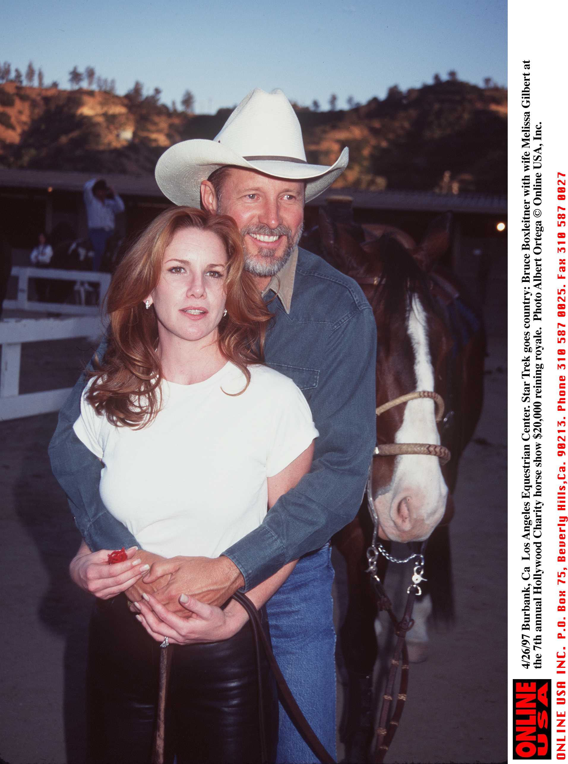 Melissa Gilbert in a white shirt and Bruce Boxleitner at the Los Angeles Equestrian Center.