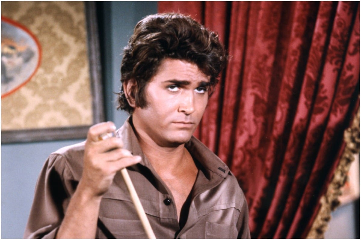 Michael Landon (1936-1991), US actor, wearing a brown shirt and grey trousers, chalking a pool cue, in a publicity portrait issued for the US television series, 'Bonanza', USA, circa 1970. The western series starred Landon as 'Joseph 'Little Joe' Cartwright'.