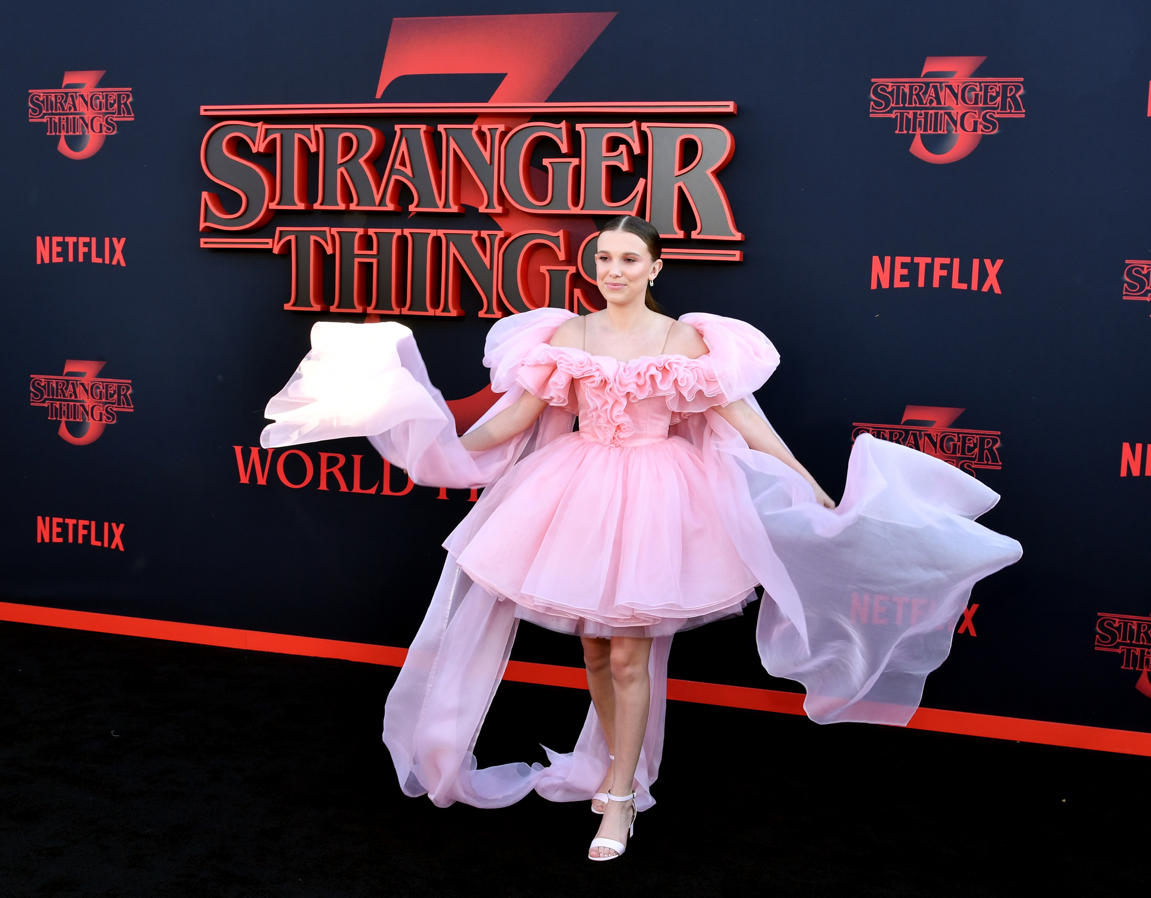 Millie Bobby Brown attends the premiere of Netflix's 'Stranger Things' Season 3 in Pink Dress