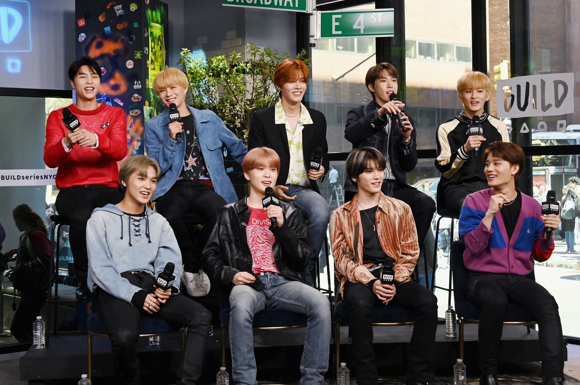 Johnny, Jungwoo, Yuta, Doyoung, Mark, Haechan, Jaehyun, Taeyong, and Taeil of NCT 127 take part in a Build Series interview in 2019